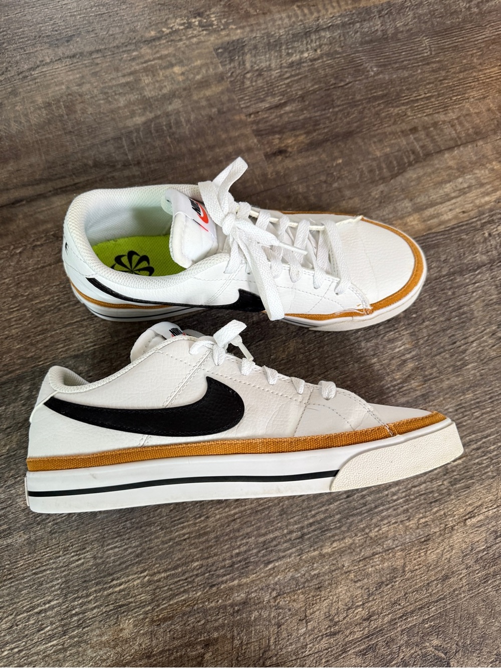 Nike Courts White Low-Top Sneakers with Black Swoosh and Gold Trim